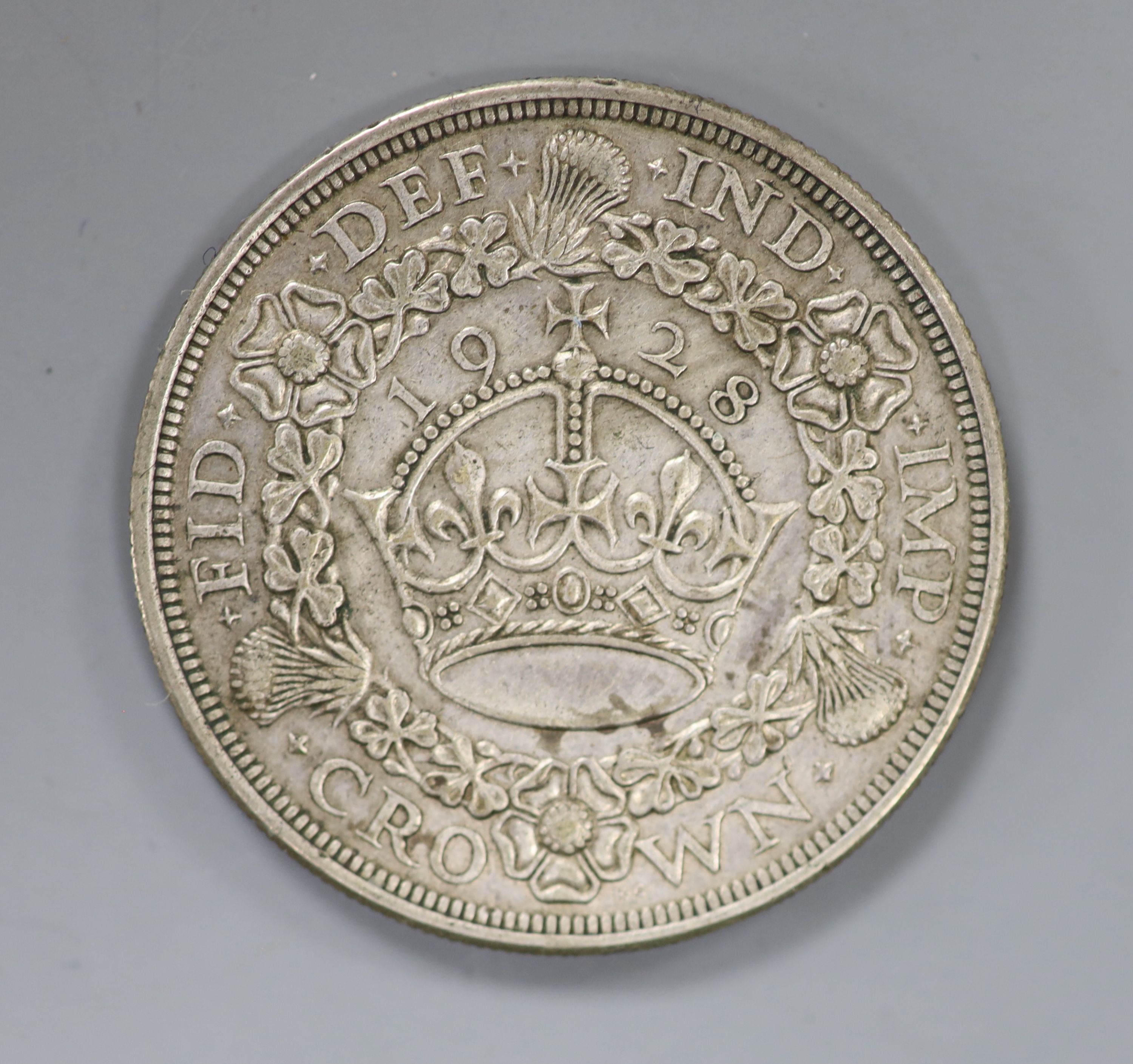 A George V crown, 1928 VF or better